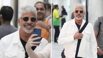 O cantor Lulu Santos posa com fãs e marido, Clebson Teixeira, mantém discrição em aeroporto do Rio de Janeiro; confira - Reprodução/AgNews